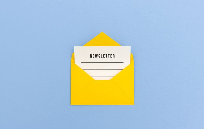 Image of physical envelope and newsletter inside How to Increase Newsletter Subscribers