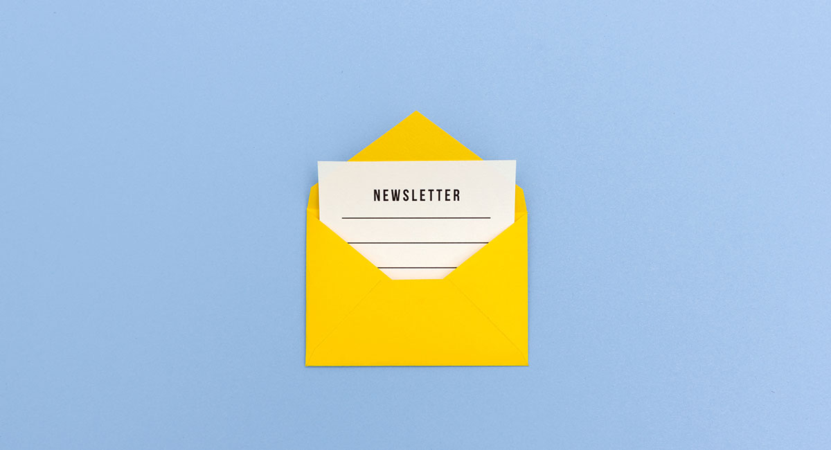 Image of physical envelope and newsletter inside How to Increase Newsletter Subscribers