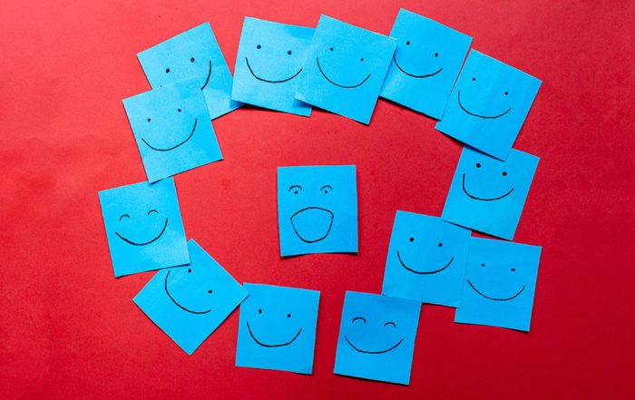 Blue sticky notes with faces